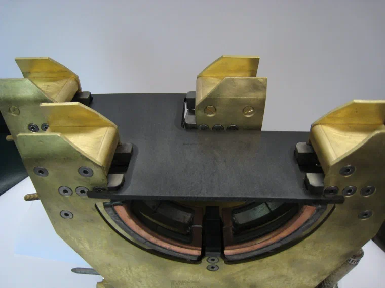 Machined induction coil with SMC flux controllers